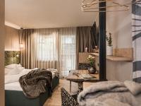 Łóżko lub łóżka w pokoju w obiekcie Hotel Sieghard Zillertal