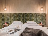 Łóżko lub łóżka w pokoju w obiekcie Hotel Sieghard Zillertal