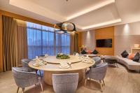 a dining room with a table and chairs at Four Points by Sheraton Guangzhou Financial City, Tianhe in Guangzhou