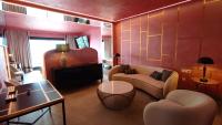 a living room with a couch and a table at Hotel Ritual Torremolinos- Adults Only in Torremolinos