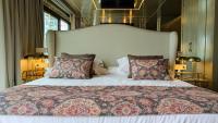 a bedroom with a large bed with a large headboard at Hotel Ritual Torremolinos- Adults Only in Torremolinos