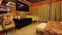 a hotel room with a bed and a desk and chairs at Hotel Ritual Torremolinos- Adults Only in Torremolinos