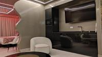 a living room with a tv and a chair at Hotel Ritual Torremolinos- Adults Only in Torremolinos