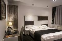 Posteľ alebo postele v izbe v ubytovaní Log In Rooms