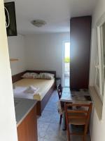 Postel nebo postele na pokoji v ubytování Apartments Suzana