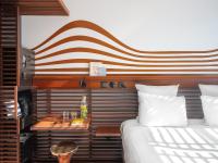 a bedroom with a bed and a table next to it at Hotel OFF Paris Seine in Paris