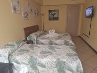 A bed or beds in a room at Argentiere Room Apartments