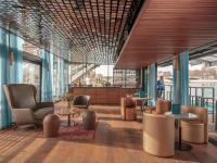 a rendering of a lobby with tables and chairs at Hotel OFF Paris Seine in Paris