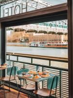 a table with plates of food on top of a balcony at Hotel OFF Paris Seine in Paris