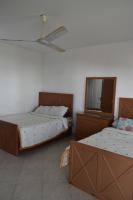 Postel nebo postele na pokoji v ubytování Golden Beach 2 Ras Sedr شاليه على البحر قرية جولدن بيتش 2 راس سدر
