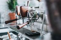 a coffee machine sitting on a counter with a glass at UBC Okanagan Campus in Kelowna