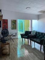 a living room with two couches and a table at Pousada QUERÊNCIA FRANCÊS in Marechal Deodoro