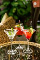 a group of three cocktails sitting on a tray at ชญาดา การ์เด้นเฮาส์ & รีสอร์ท Hotel in Nakhon Ratchasima