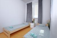 Posteľ alebo postele v izbe v ubytovaní Apartament Słoneczny 5