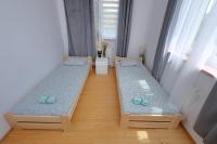 Posteľ alebo postele v izbe v ubytovaní Apartament Słoneczny 5