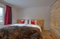 Łóżko lub łóżka w pokoju w obiekcie Chalet Dorfkristall