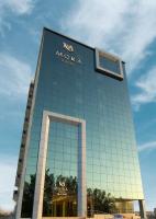 a building with a sign on the side of it at Mora Hotel in Al Khobar