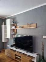 Televízia a/alebo spoločenská miestnosť v ubytovaní Stone House Iva