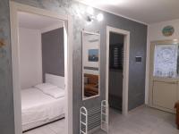Posteľ alebo postele v izbe v ubytovaní villa Porto fossa
