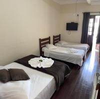 Hotel Chão Mineiroにあるベッド