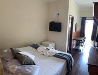 Hotel Chão Mineiroにあるベッド