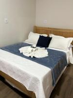 Hotel Chão Mineiroにあるベッド