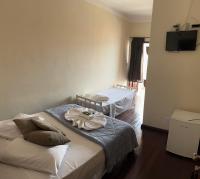 Hotel Chão Mineiroにあるベッド