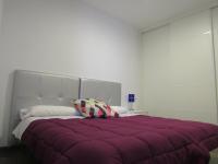 A bed or beds in a room at Apartamentos Ilíberis
