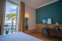 Łóżko lub łóżka w pokoju w obiekcie Grand Hotel Alassio Beach & Spa Resort - The Leading Hotels of the World