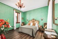 Posteľ alebo postele v izbe v ubytovaní Hotel Ca' Alvise