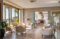 A seating area at B&B HOTEL Diano Marina Palace