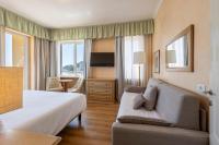 A television and/or entertainment centre at B&B HOTEL Diano Marina Palace