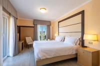 A bed or beds in a room at B&B HOTEL Diano Marina Palace