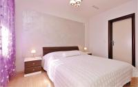 Postel nebo postele na pokoji v ubytování Apartment Posedarje 32