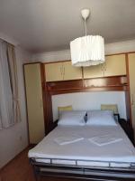 Posteľ alebo postele v izbe v ubytovaní Apartman SARA GALILEO BLIZU PLAZE