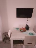 Televízia a/alebo spoločenská miestnosť v ubytovaní Casa vacanze su sorighe.