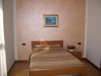 Posteľ alebo postele v izbe v ubytovaní Albergo Il Castellino