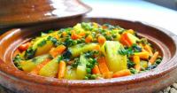 a bowl of vegetables with peas and carrots at Auberge Kasbah Amoun in Taliouine