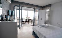 A bed or beds in a room at Moon & Sun otel