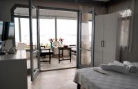 A bed or beds in a room at Moon & Sun otel
