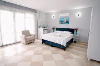 A bed or beds in a room at Moon & Sun otel