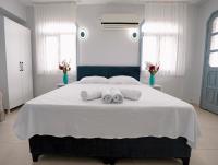 A bed or beds in a room at Moon & Sun otel