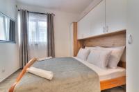 Posteľ alebo postele v izbe v ubytovaní Ivan apartman