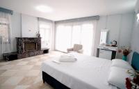 A bed or beds in a room at Moon & Sun otel