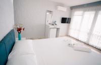 A bed or beds in a room at Moon & Sun otel