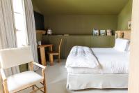 Ein Bett oder Betten in einem Zimmer der Unterkunft Les Sources de Caudalie