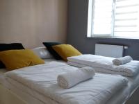 Posteľ alebo postele v izbe v ubytovaní Apartamenty Miku