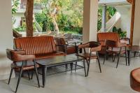 Et opholdsområde på Putri Ayu Cottages