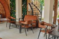 Et opholdsområde på Putri Ayu Cottages