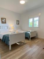 Posteľ alebo postele v izbe v ubytovaní Independent Villa BEACH HOUSE EL BOSQUE